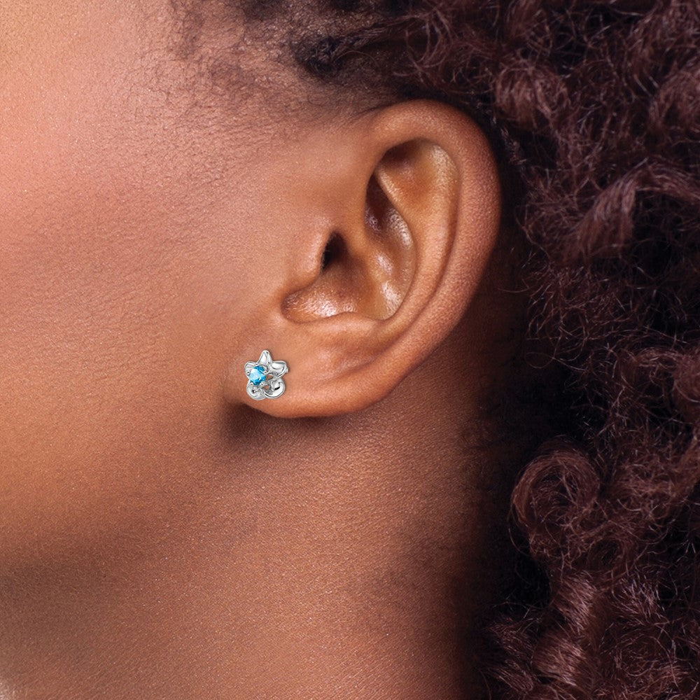 Rhodium-plated Sterling Silver Floral Blue Topaz Post Earrings